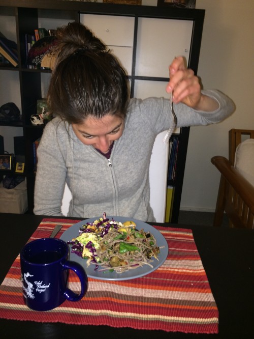 Lauren enthusiastically digging into her dinner