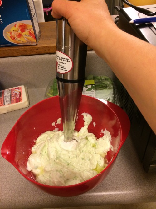 blending together the greek yogurt and peas for the sauce with my handy immersion blender