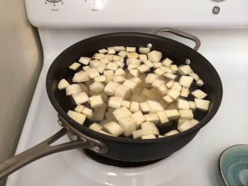 Boiling parsnips and potatoes for the dumplings