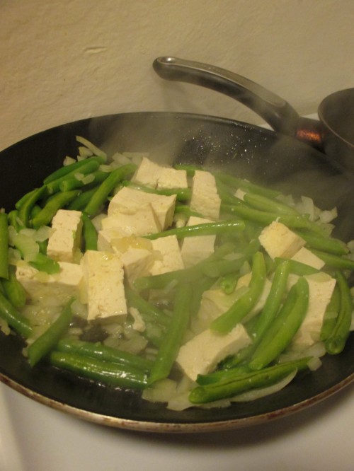 tofu and green beans cooking in peanut oil