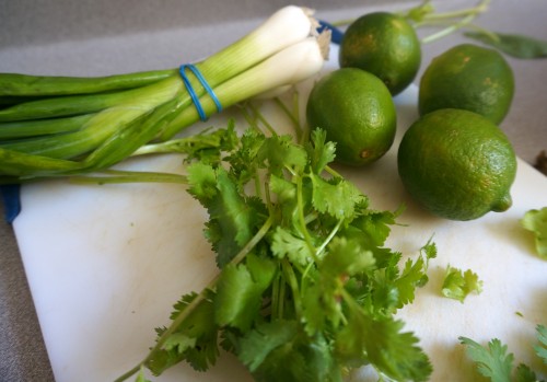 Green onions, cilantro, and limes for the green pancakes with lime butter