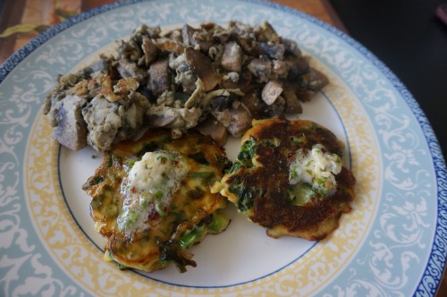 Green pancakes with lime butter with scrambled eggs with mushrooms and onions