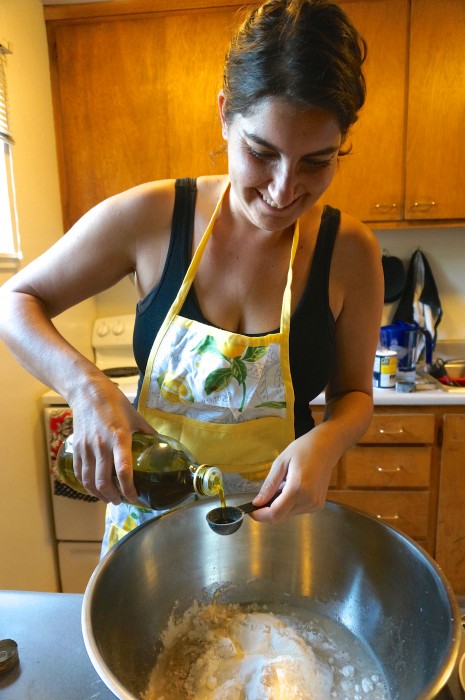 Measuring out ingredients for the challah - I love how happy Stav looks!