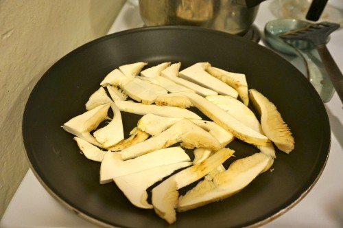 Matsutakes cleaned and sliced in the pan
