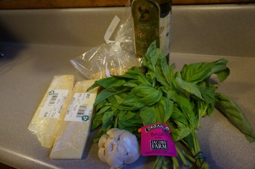 Ingredients for the pesto: olive oil, garlic, basil, pine nuts, parmesan cheese.